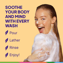 Foamy body wash on a woman’s skin, with St. Ives oatmeal & shea butter bottle
