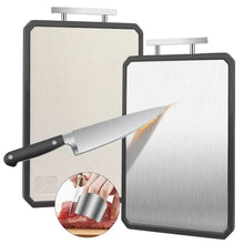Double-sided cutting board with handle and finger guard, paired with a chef knife.