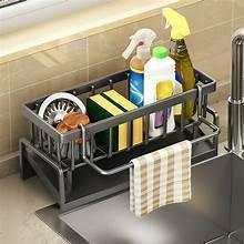 Kitchen sink caddy with drain tray, utensil holders, and soap bottle organizer