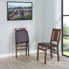 Two wood folding chairs with dark gray padded seats and slatted backrests
