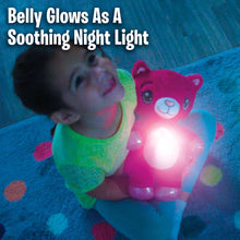 Pink plush cat night light glowing beside a child