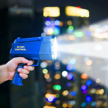 Handheld blue tactical flashlight in a left hand, bright beam forward