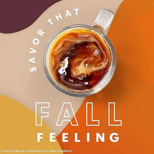 Glass cup of amber coffee with swirling crema