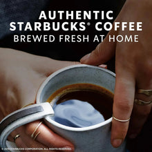 Cup of dark roast coffee with crema, brewed at home