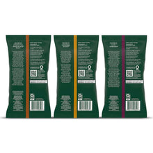 Back of three ground coffee packets with barcode and roasting info