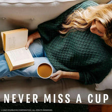 Woman holding a cup of coffee
