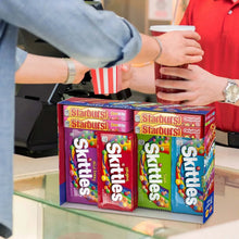Starburst and Skittles candy box held on a counter with multiple packs shown.