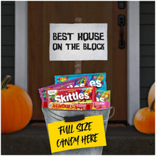 Candy bucket filled with Starburst and Skittles assorted packs