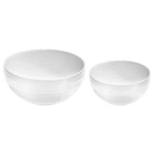 Staub ceramic serving bowls: two white bowls with embossed side rings