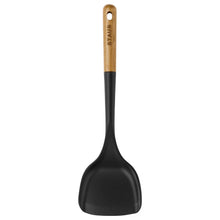 Kitchen spoon spatula with black silicone head and wood handle with hanging hole