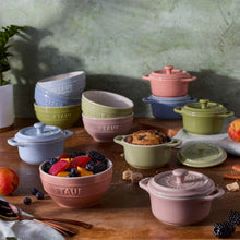 Pastel ceramic mini Dutch oven and bowl set with lidded pots and bowls on table