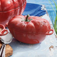 Red tomato-shaped cocotte with matching lid, two side handles