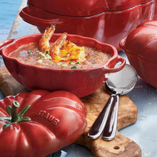 Red tomato cocotte with interior baked dish, green stem finial and side handles
