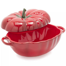 Red tomato cocotte with domed lid, green stem, side handle