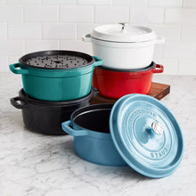 Round enamel Dutch oven set with lids in white, black, red, and teal, 4 qt style