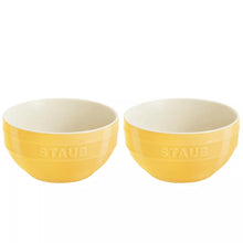 Yellow stoneware bowls, set of 2, shallow round shape with embossed STAUB