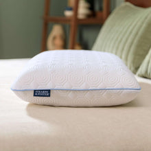 Latex cooling pillow, white embossed pattern with blue seam trim and logo patch
