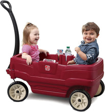 Red kids ride-on wagon toy with handle, four wheels, and seat with belts