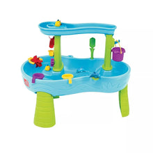 Two-tier kids splash water table with blue top, green legs, and toy water spouts