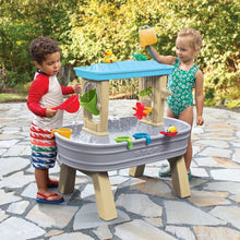 Step2 splash water table with blue lid, clear sides, and colorful water toys