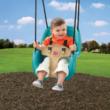 Step2 teal toddler swing seat with beige T-bar on outdoor playground