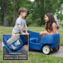 Blue kids ride-on wagon with child and adult, plus inset showing cup holders