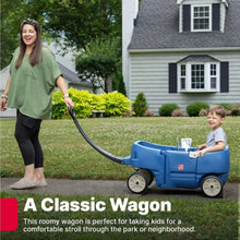 Blue two-seat kids wagon with long handle and wheels, child seated outdoors