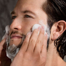 Cooling exfoliant wash foam applied on face and beard