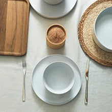 Celina dinnerware set with light gray plate and small bowl, plus cutlery