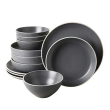 Gray speckled stoneware dinnerware set, stacked bowls and large plates