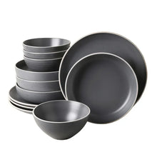 Gray stoneware dinnerware set: stacked bowls and plates, speckled glaze