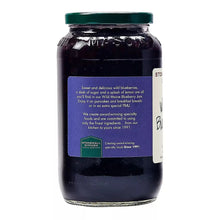 Wild Maine blueberry jam jar, back label side view, green lid