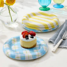 Round yellow and blue checkered appetizer plate with cake on top