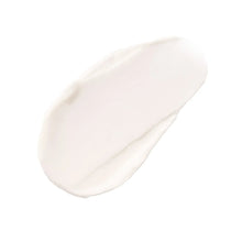 Pale white face cream swatch in a soft smear