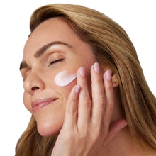 Peptide plump collagen cushion cream on cheek and under-eye, woman applying with hands