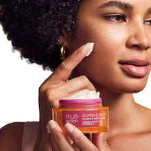 Vitamin C night cream jar held in hands with woman’s cheek and lips