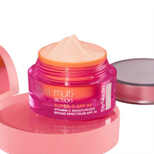 Vitamin C SPF moisturizer jar with open lid and pink cream inside