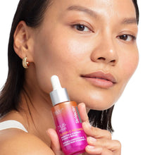 StriVectin Super C retinol serum held near cheek and jaw