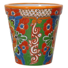 Ceramic planter with orange rim, red and blue flowers and swirls on green base