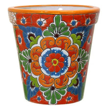 Ceramic Talavera planter with orange rim, large blue-red flower center and green accents