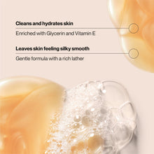 Foaming body wash lather with creamy beige suds in a clear bowl