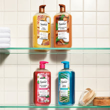 Assorted body wash bottles on shelf, including Milk & Honey