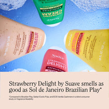 Assorted Suave exfoliating body wash bottles, including Strawberry Delight, lying on surface