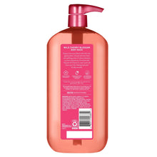 Pink body wash bottle back with pump, barcode and label panel
