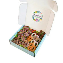 Open Easter chocolate gift box with striped bars, bunnies, and decorated cookies