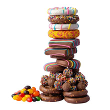 Stack of assorted Easter chocolate cookies with sprinkle coating and striped drizzle