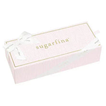Valentine candy bundle wrapped in pink striped box with gold Sugarfina logo