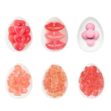 Assorted heart gummy candies in red and pink with mixed shapes