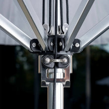 SunVilla umbrella tilt mechanism close-up with bolts, cords, and silver frame