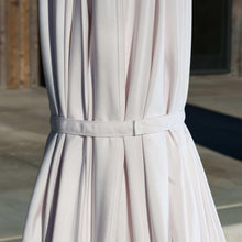 White patio umbrella fabric with gathered skirt and gray tie band